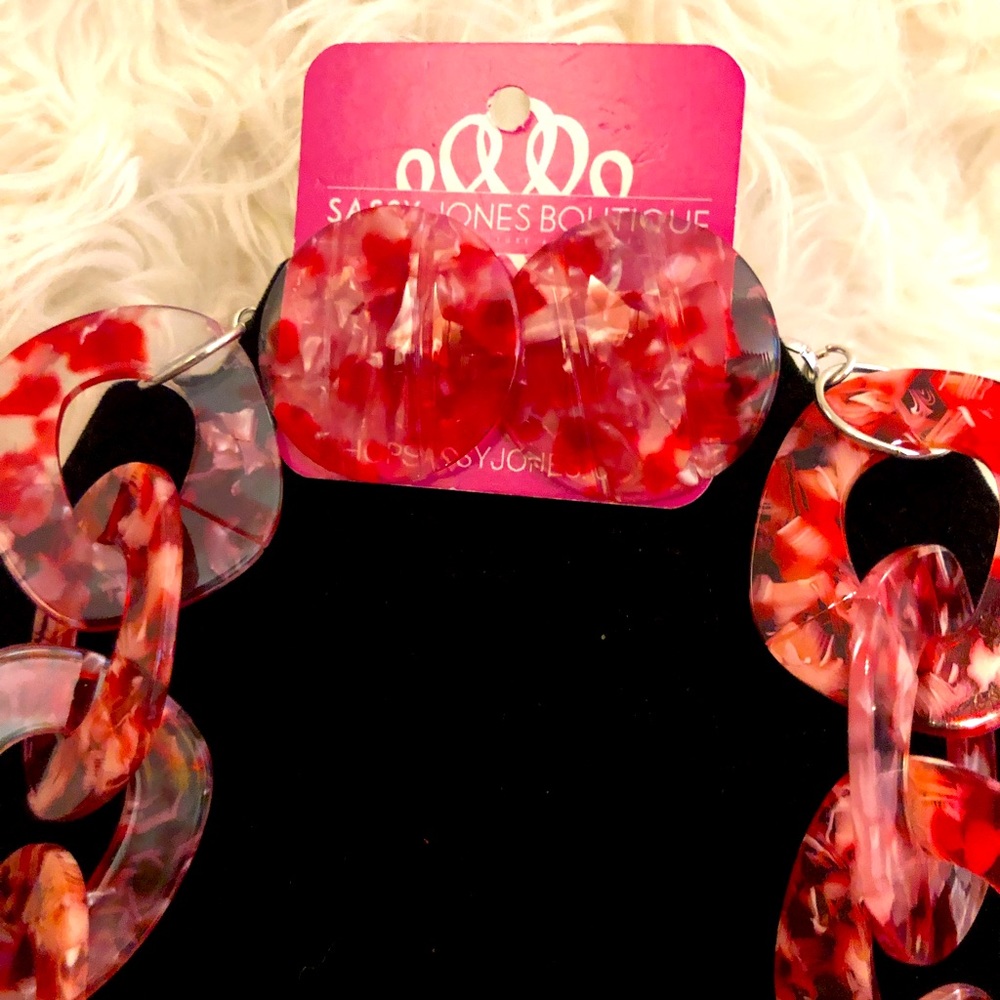 Sassy Jones Zaria necklace and stud earring set. Red, and clear speck pattern.